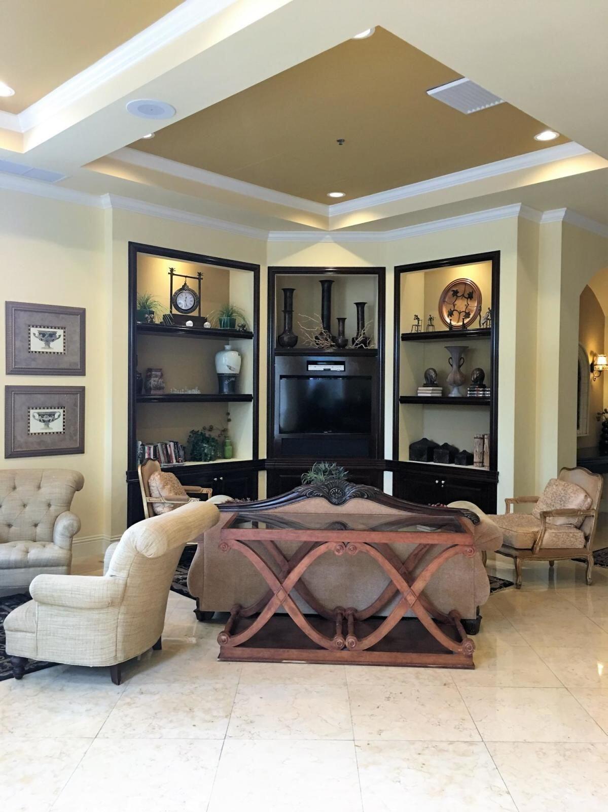 616 Clearwater Park Road, Unit 413 West Palm Beach, FL 33401 - Photo 14 of 21 a bedroom with bed and a large window