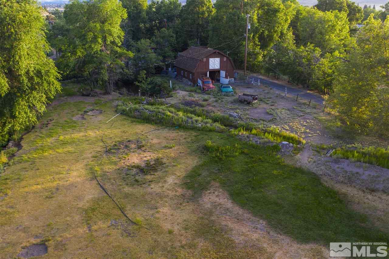 2401 Holcomb Ranch Lane Reno, NV 89511 - Photo 18 of 18 a backyard of a house with a yard and trampoline