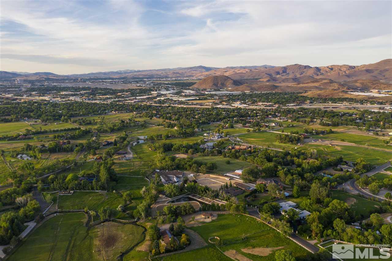 2401 Holcomb Ranch Lane Reno, NV 89511 - Photo 2 of 18 an aerial view of residential houses with outdoor space and trees