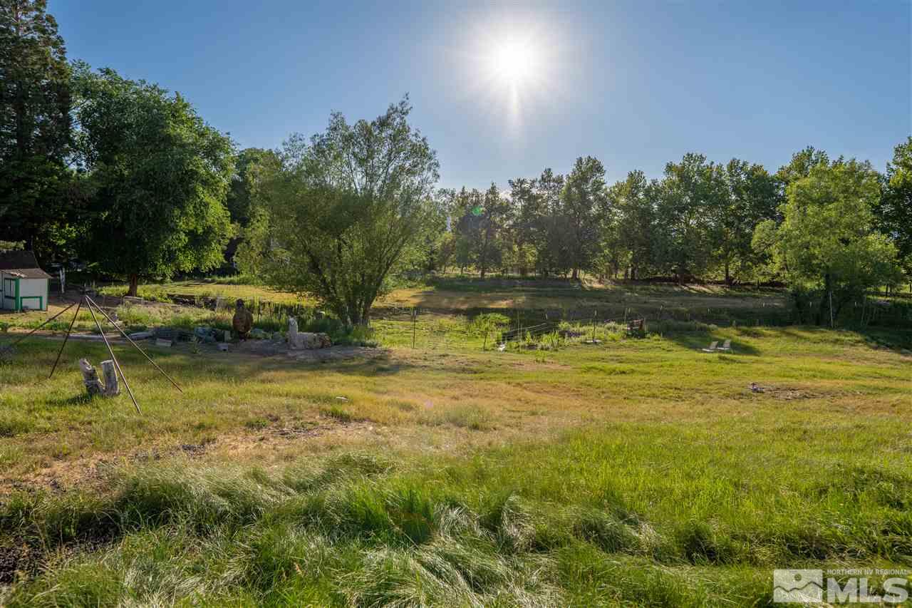 2401 Holcomb Ranch Lane Reno, NV 89511 - Photo 7 of 18 a view of a water pond with green yard