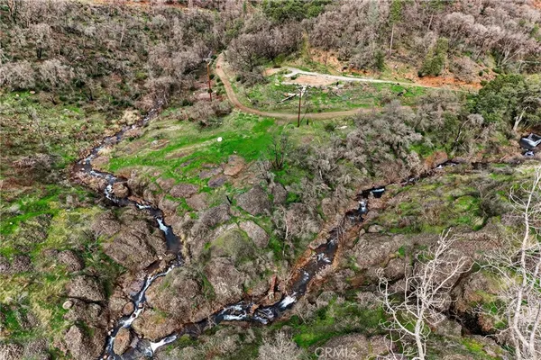 a aerial view of a houses with a yard