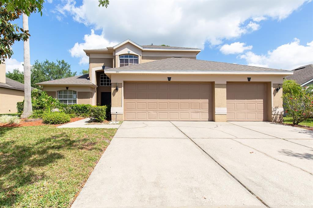 341 Kirkhill Street Ocoee, FL 34761 - Photo 1 of 1 a front view of a house with a yard and garage