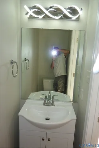 a bathroom with a sink and mirror