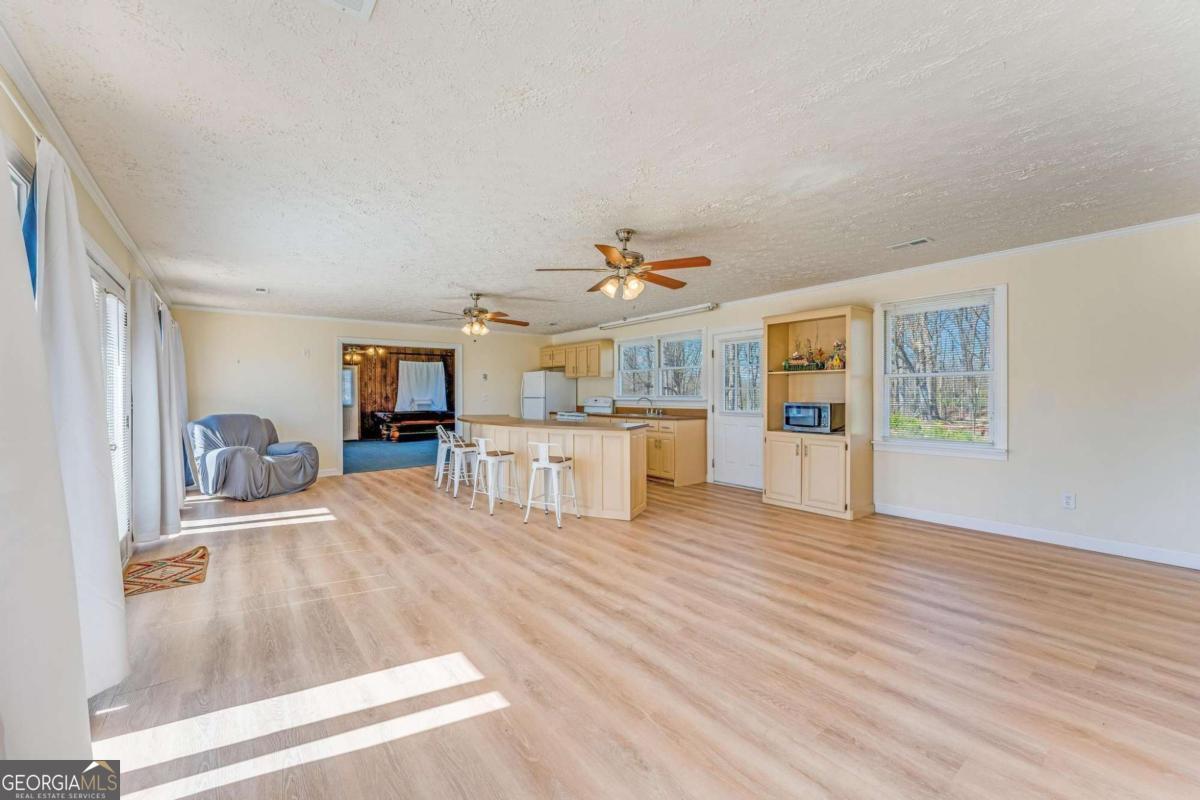 417 Pulliam Lane Royston, GA 30662 - Photo 17 of 27 a view of kitchen with furniture and wooden floor