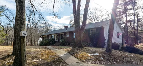 a view of a house with snow on the tree