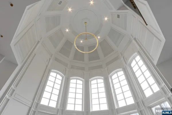 a view of room with window and wooden floor