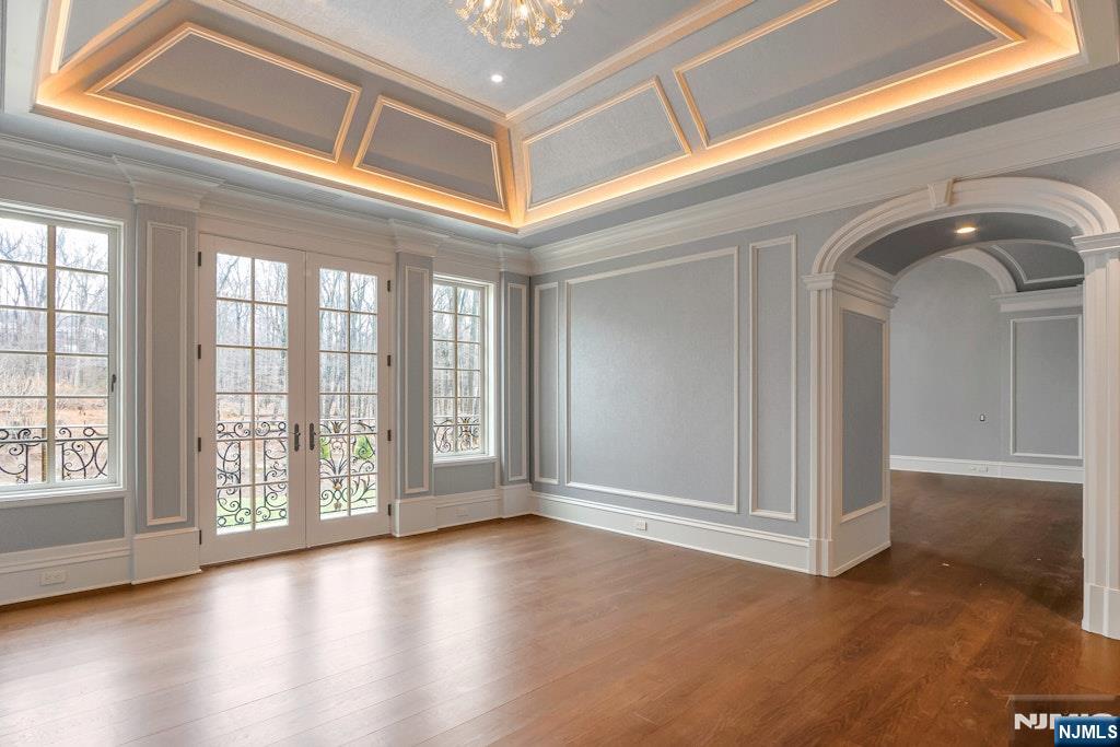 10 Frick Drive Alpine, NJ 07620 - Photo 15 of 28 a view of an empty room with wooden floor and windows