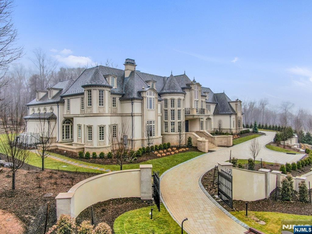 10 Frick Drive Alpine, NJ 07620 - Photo 26 of 28 a front view of a house with swimming pool