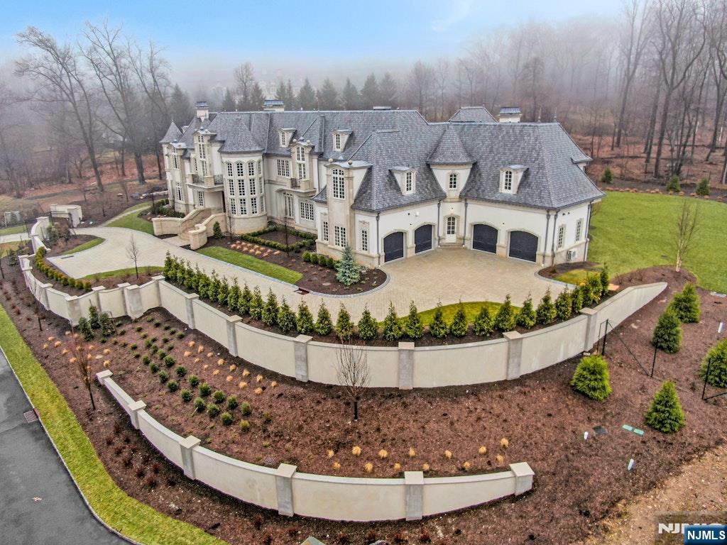 10 Frick Drive Alpine, NJ 07620 - Photo 27 of 28 a view of a swimming pool with a patio