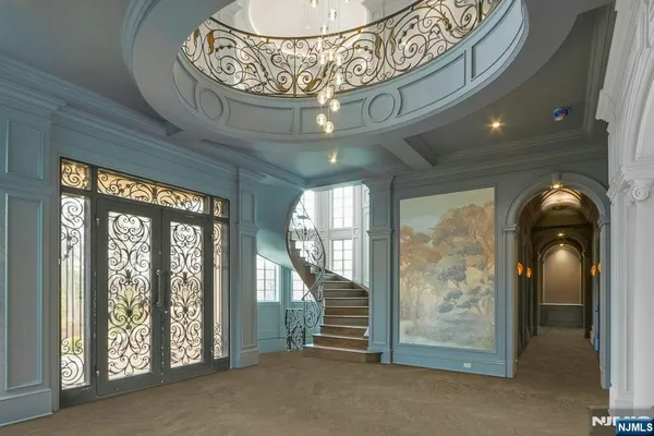 a large bathroom with a large tub and sink