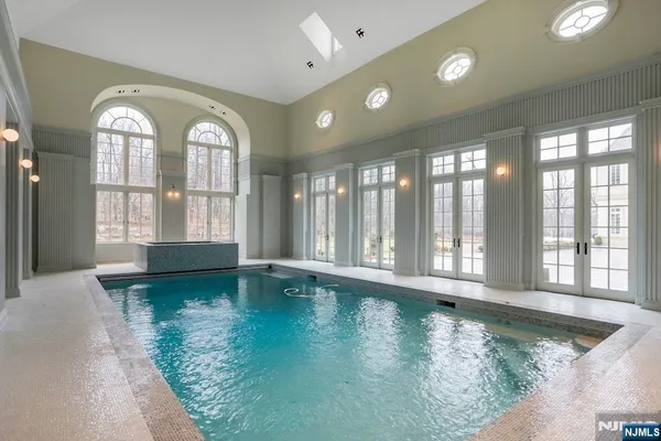 a large room with a large window and chandelier
