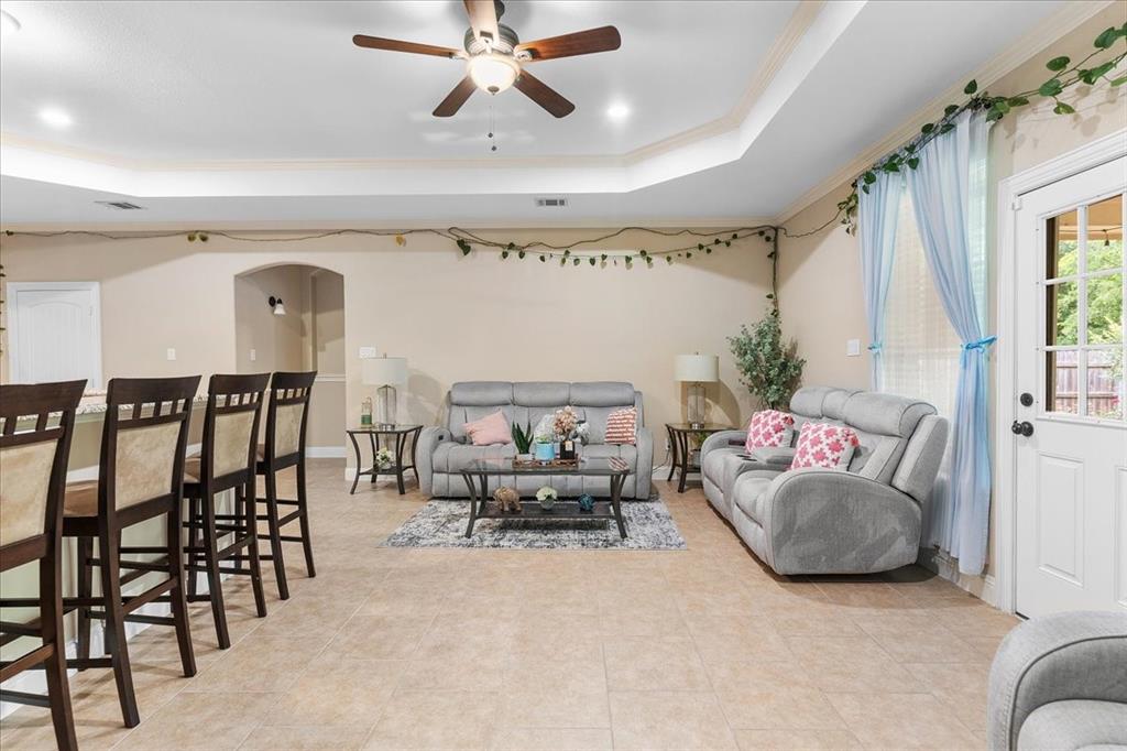 502 Ritchey Street Gainesville, TX 76240 - Photo 18 of 29 a living room with furniture and a chandelier