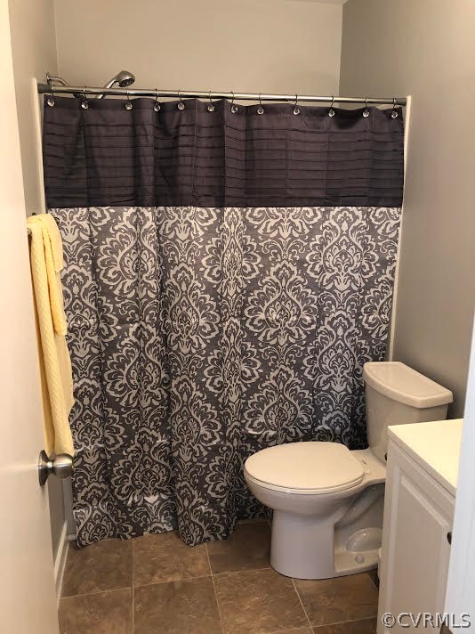 5012 Wilconna Road Chesterfield, VA 23832 - Photo 11 of 14 a bathroom with a toilet and a shower curtain