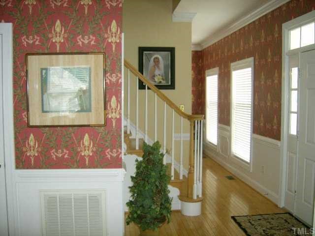 65 Landmark N Road Roxboro, NC 27574 - Photo 2 of 12 FOYER HAS 2 STORY STAIR CASE, OPEN HALLWAY THAT ENTERS INTO THE SPACIOUS LIVING AREA