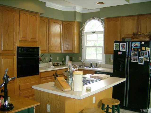 65 Landmark N Road Roxboro, NC 27574 - Photo 5 of 12 GREAT KITCHEN WITH APPLIANCES AND ISLAND COOK TOP