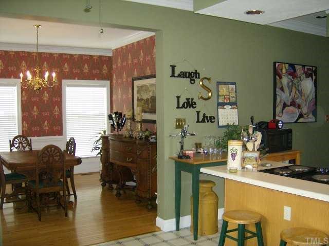 65 Landmark N Road Roxboro, NC 27574 - Photo 7 of 12 OPENING FROM THE KITCHEN TO DINING ROOM. THIS HOME IS SO ENTERTAINING FRIENDLY