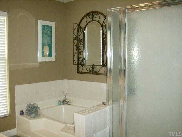 65 Landmark N Road Roxboro, NC 27574 - Photo 9 of 12 MASTER BATH HAS GARDEN TUB WITH SEPERATE SHOWER AND LARGE WALK IN CLOSET