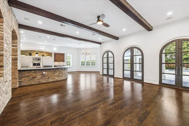 a view of an entryway with wooden floor