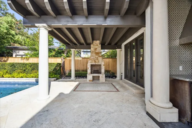 a view of porch with a table and chairs