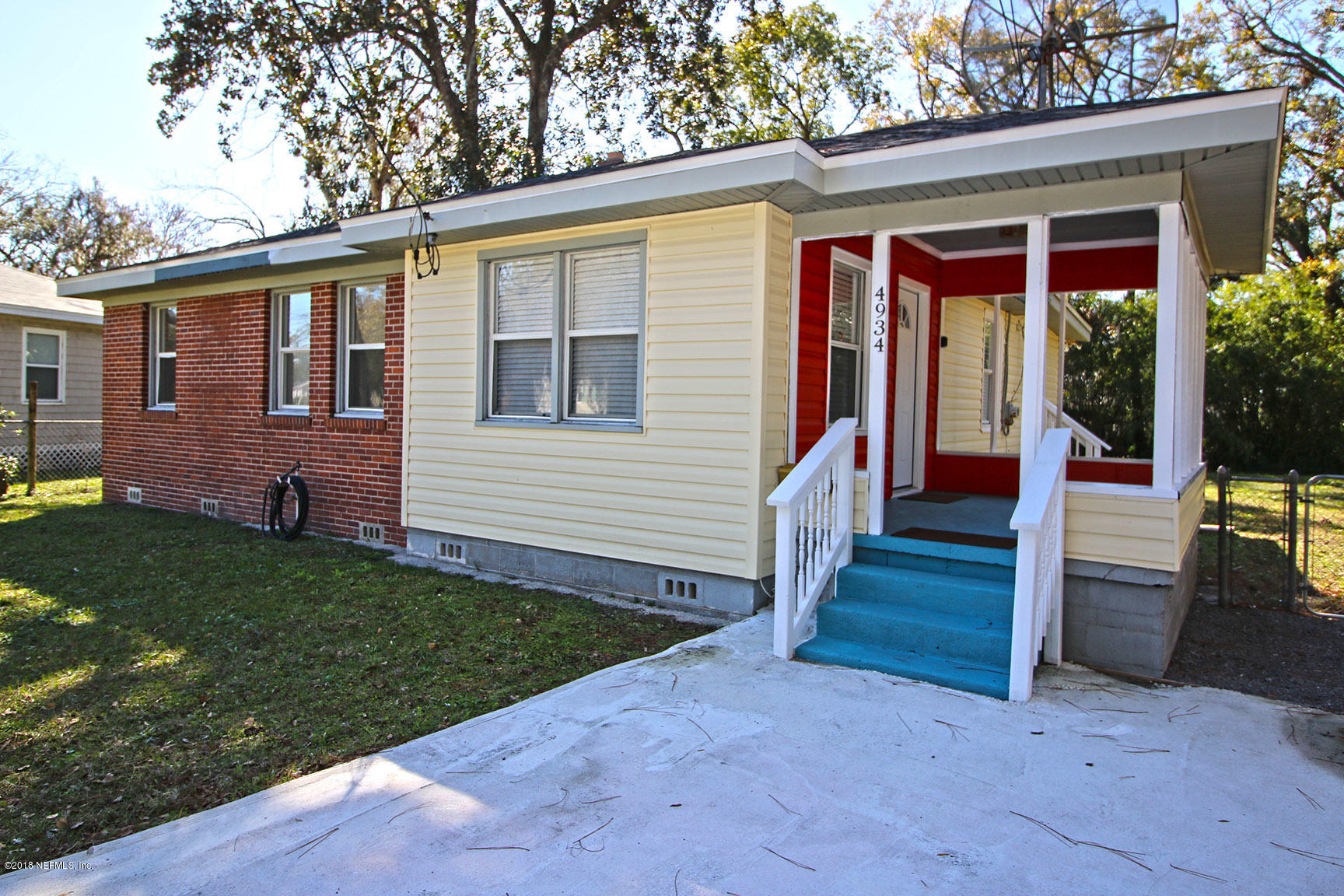 4934 Dundee Road Jacksonville, FL 32210 - Photo 1 of 15 a view of a house with backyard and porch