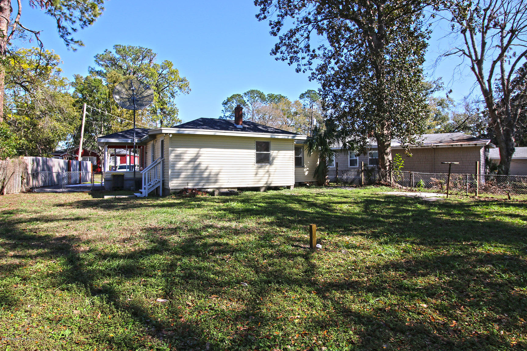 4934 Dundee Road Jacksonville, FL 32210 - Photo 13 of 15 a view of a house with a yard