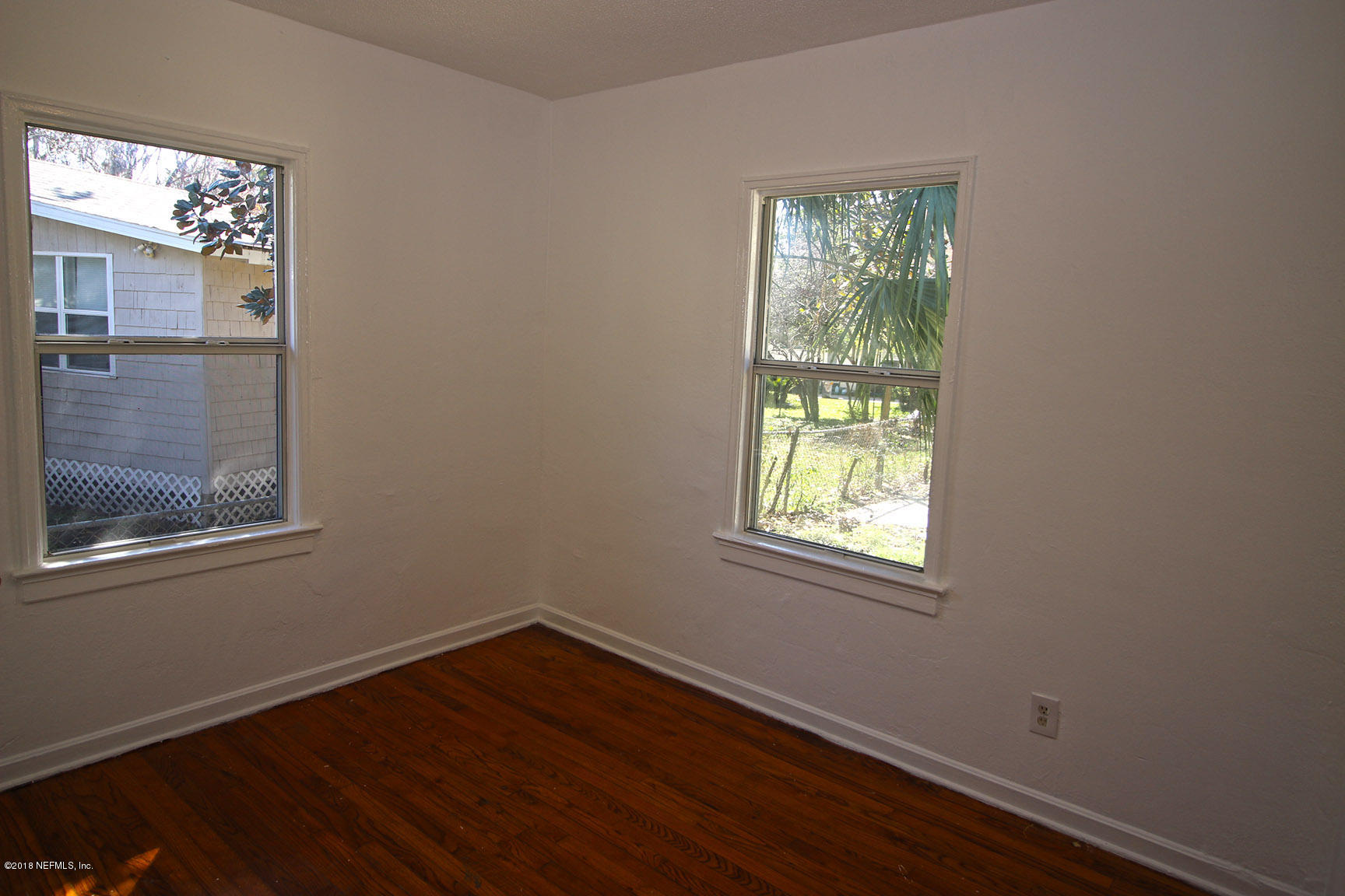 4934 Dundee Road Jacksonville, FL 32210 - Photo 10 of 15 an empty room with windows