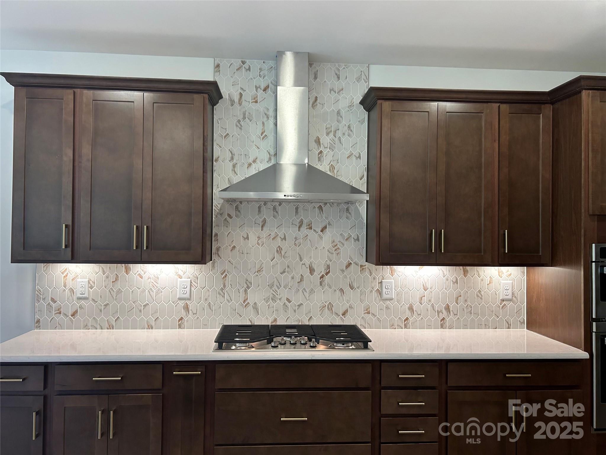 1431 Hubert Graham Way Tega Cay, SC 29708 - Photo 3 of 24 a view of kitchen cabinetry with a sink