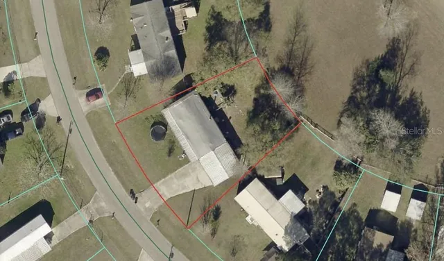 an aerial view of a house with outdoor space