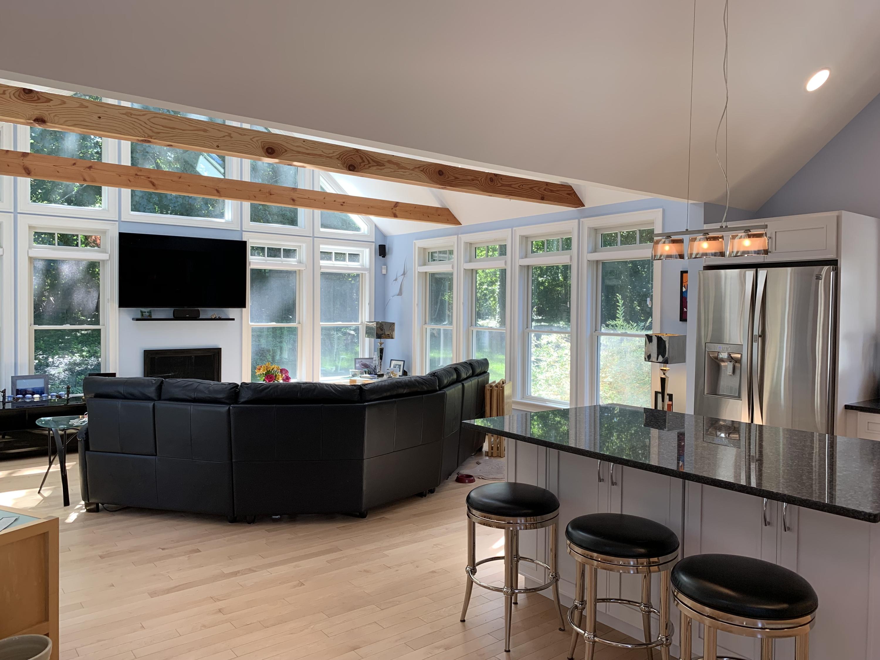 270 Hay Road Eastham, MA 02642 - Photo 15 of 42 a living room with furniture a flat screen tv and floor to ceiling window