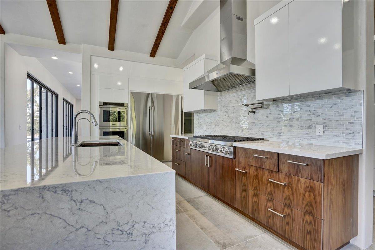 8360 Monterra Views Monterey, CA 93940 - Photo 17 of 82 a kitchen with stainless steel appliances granite countertop a sink a stove and a refrigerator