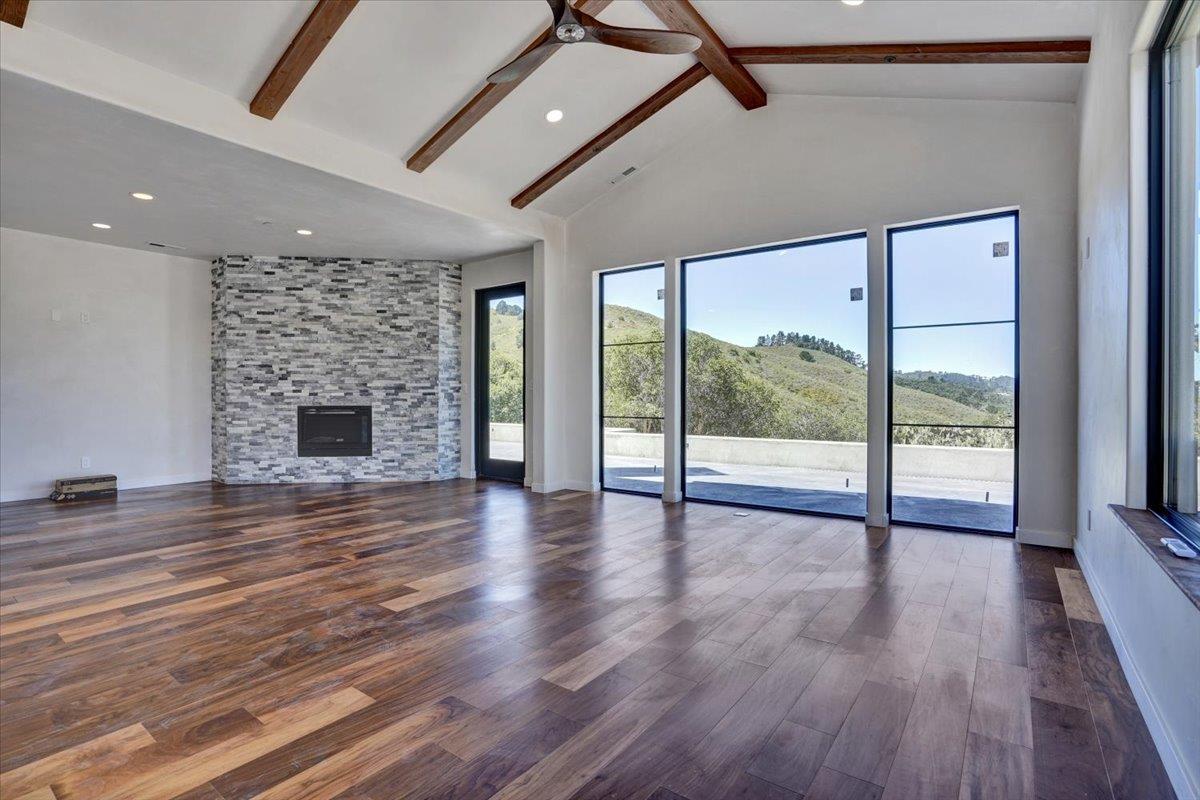 8360 Monterra Views Monterey, CA 93940 - Photo 29 of 82 a view of an empty room with wooden floor and a fireplace
