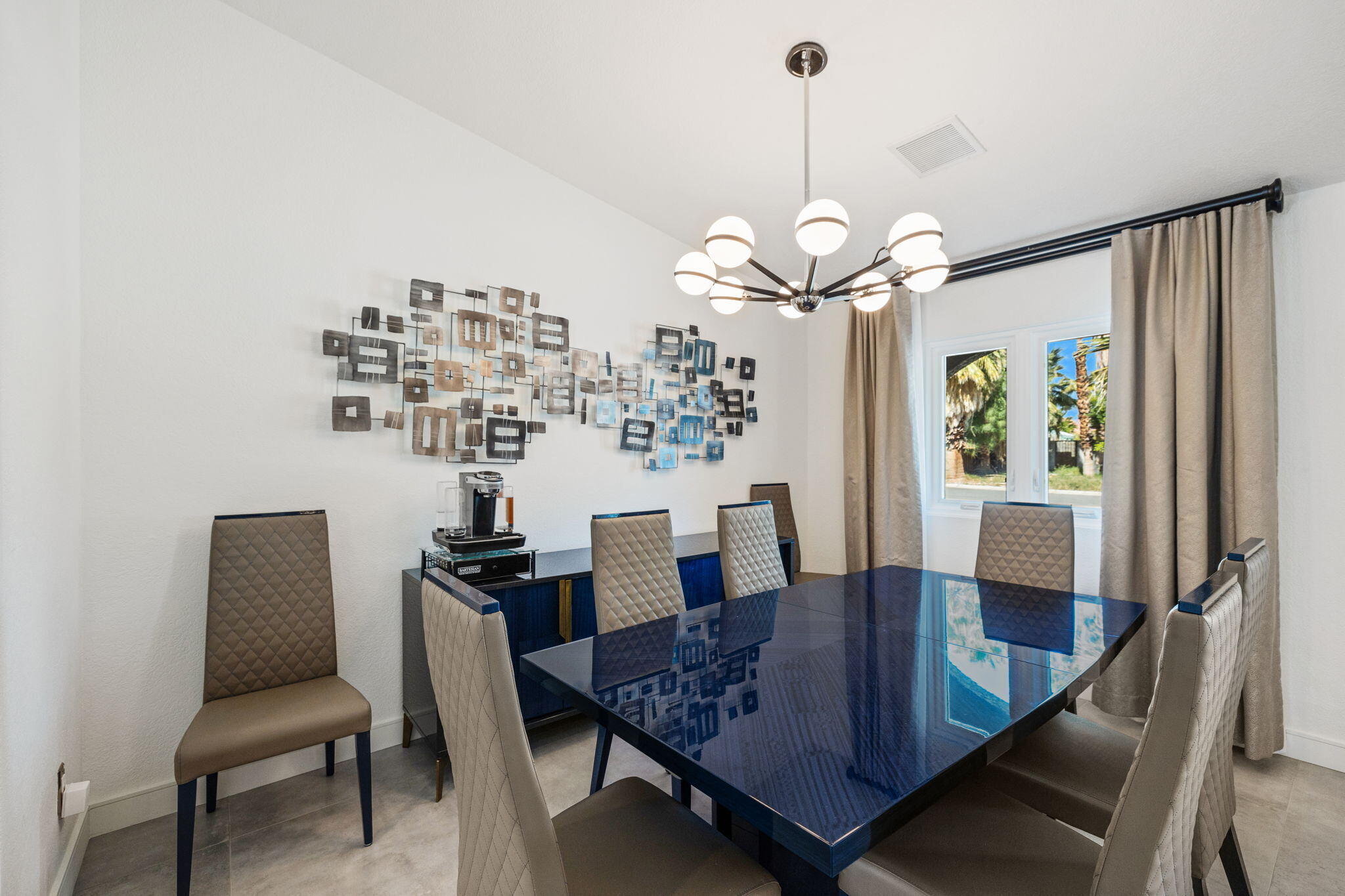 2777 East San Juan Road Palm Springs, CA 92262 - Photo 11 of 31 a view of a dining room with furniture window and wooden floor