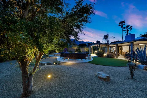 a view of a house with a back yard