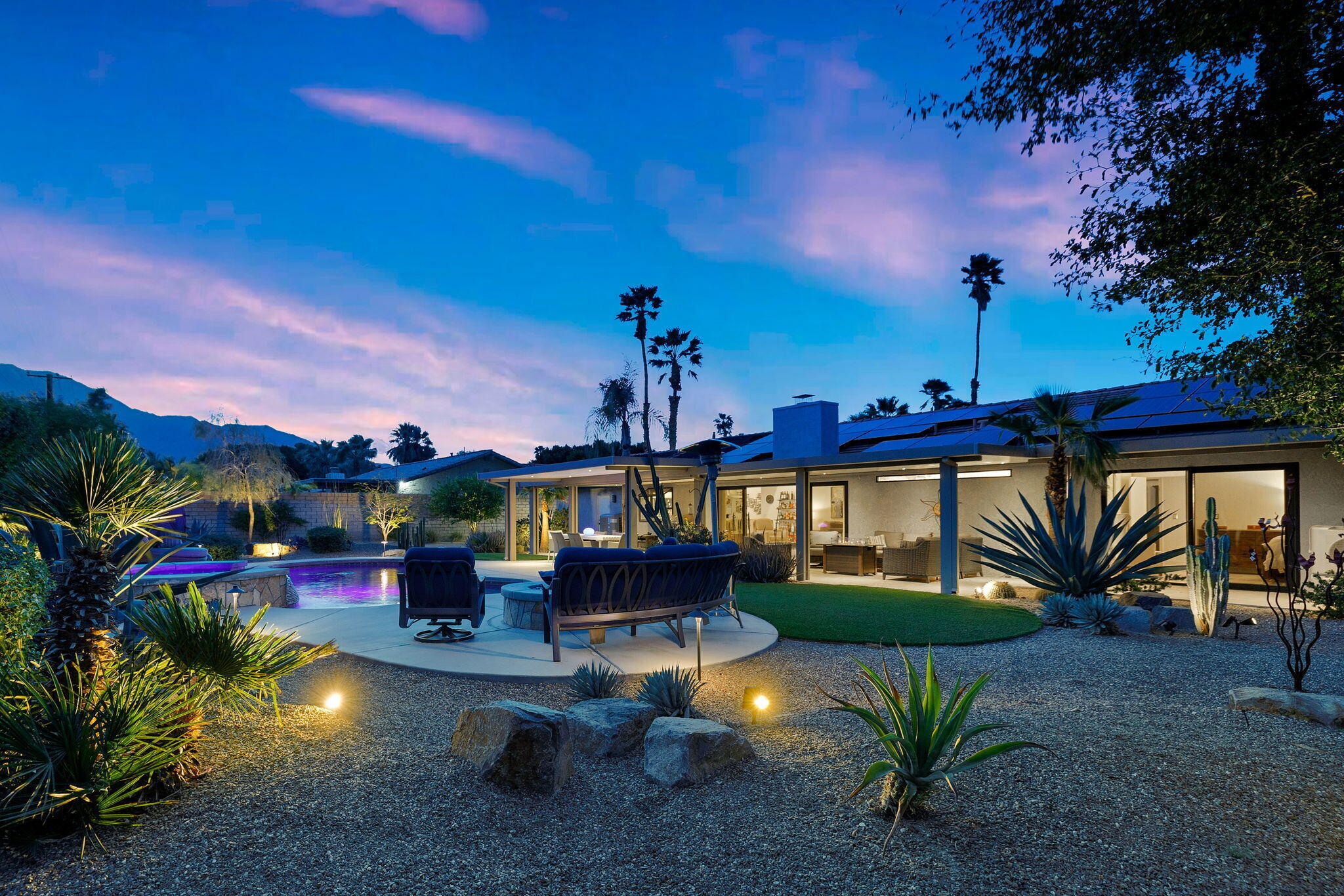 2777 East San Juan Road Palm Springs, CA 92262 - Photo 27 of 31 a view of a swimming pool with a table and chairs
