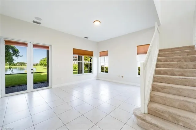 a view of an entryway with kitchen and livingroom view