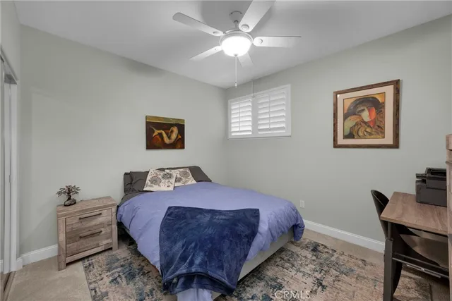 a bedroom with a bed and a table in it