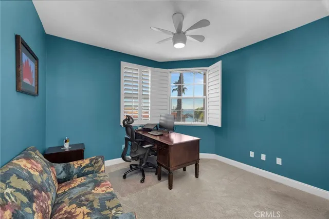 a workspace with furniture and a window