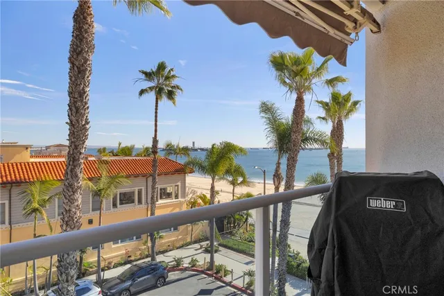 a view of a balcony with flower plants