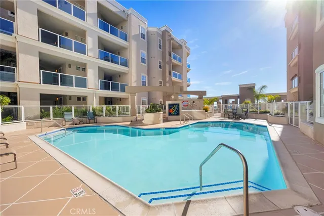 a view of swimming pool with outdoor seating