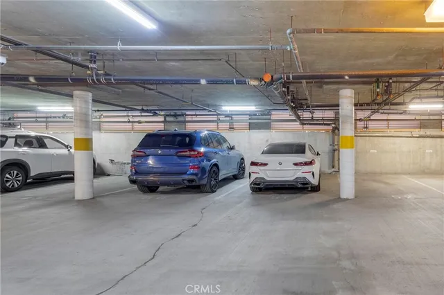 a view of parking garage with cars