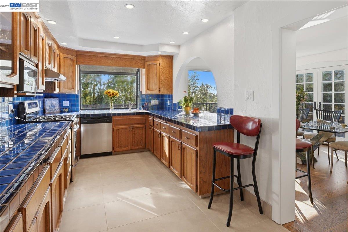 22111 Prospect Street Hayward, CA 94541 - Photo 29 of 70 a kitchen with a sink and chairs