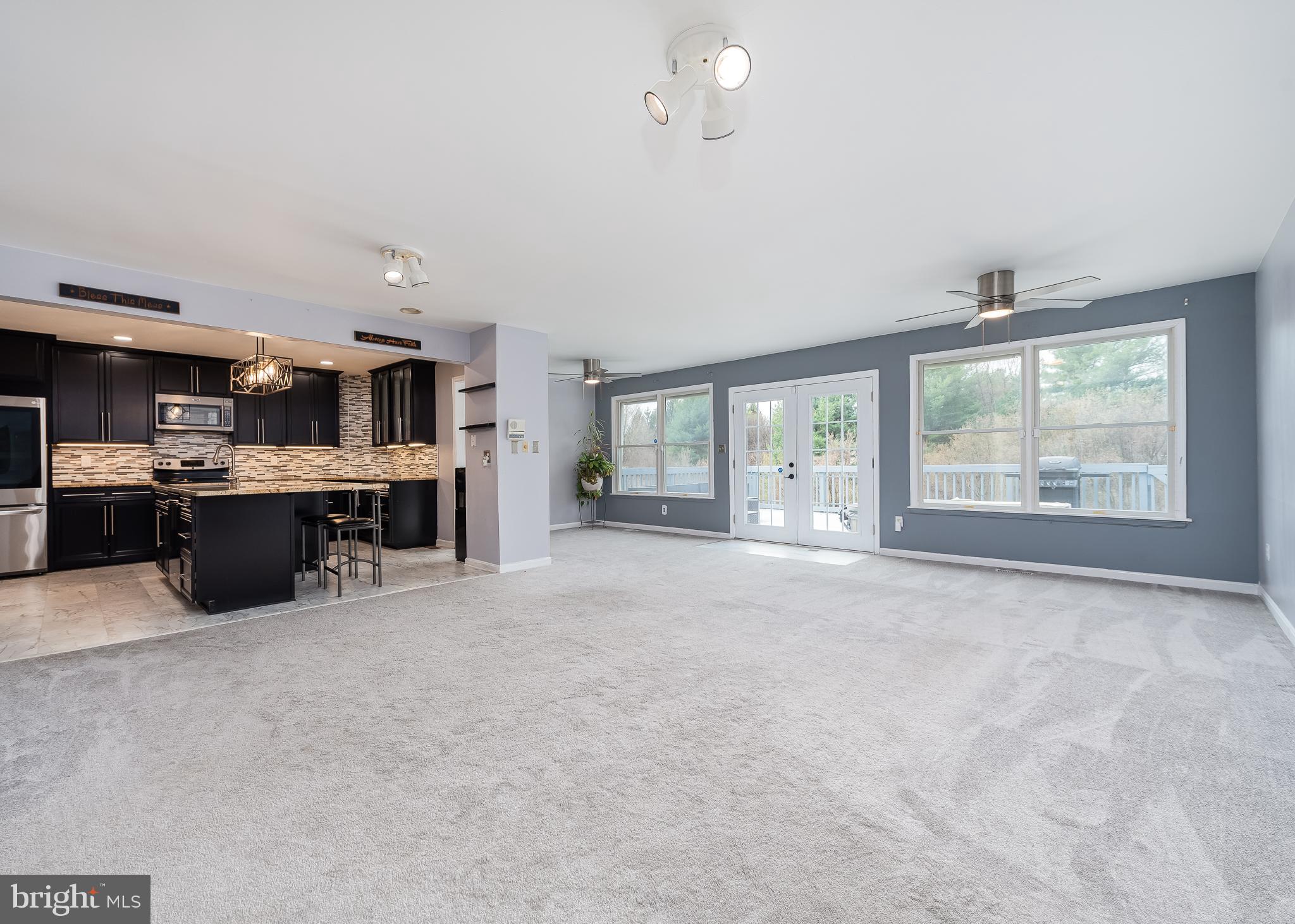 316 Delight Meadows Road Reisterstown, MD 21136 - Photo 8 of 48 Oversized main living area with sliders to back ya