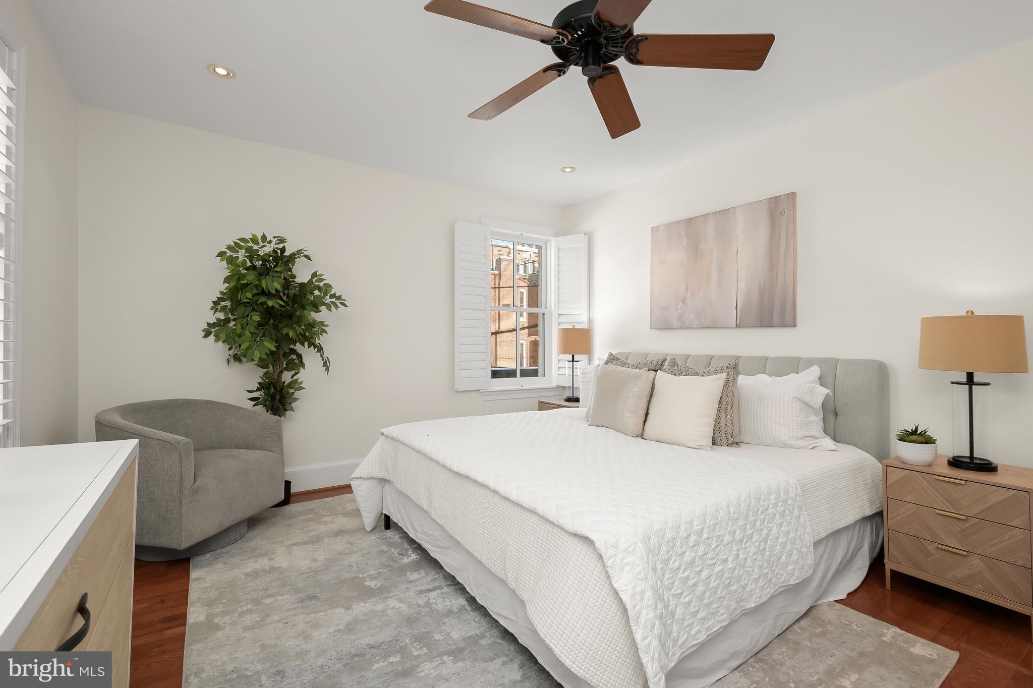 1745 S Street Northwest Washington, DC 20009 - Photo 11 of 19 a bedroom with a bed and a chandelier
