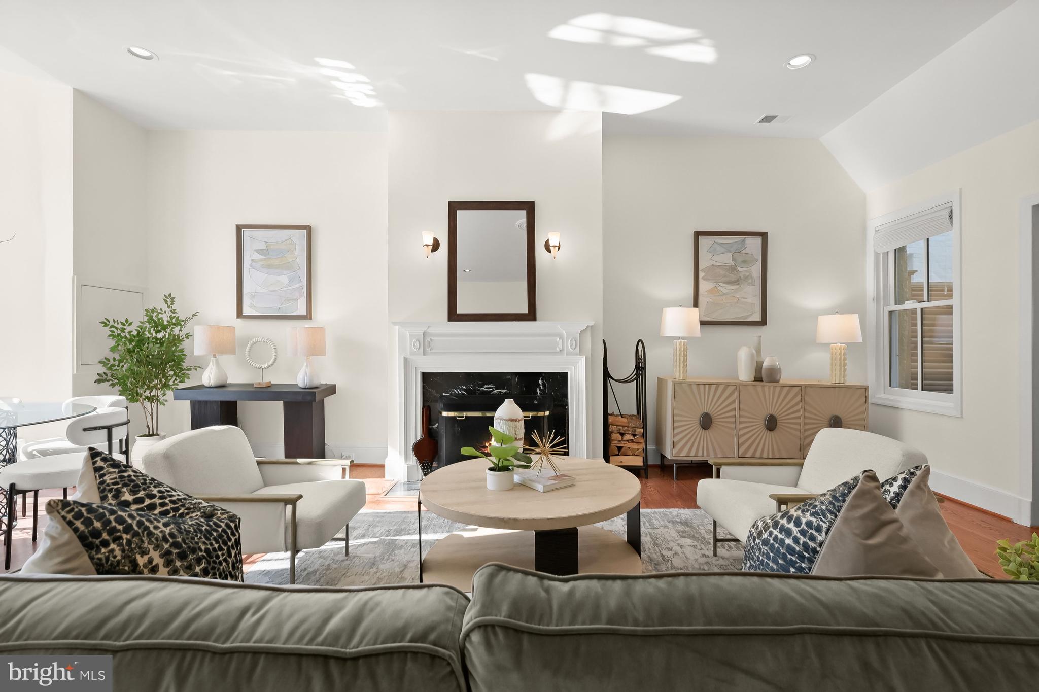 1745 S Street Northwest Washington, DC 20009 - Photo 2 of 19 a living room with furniture and a fireplace