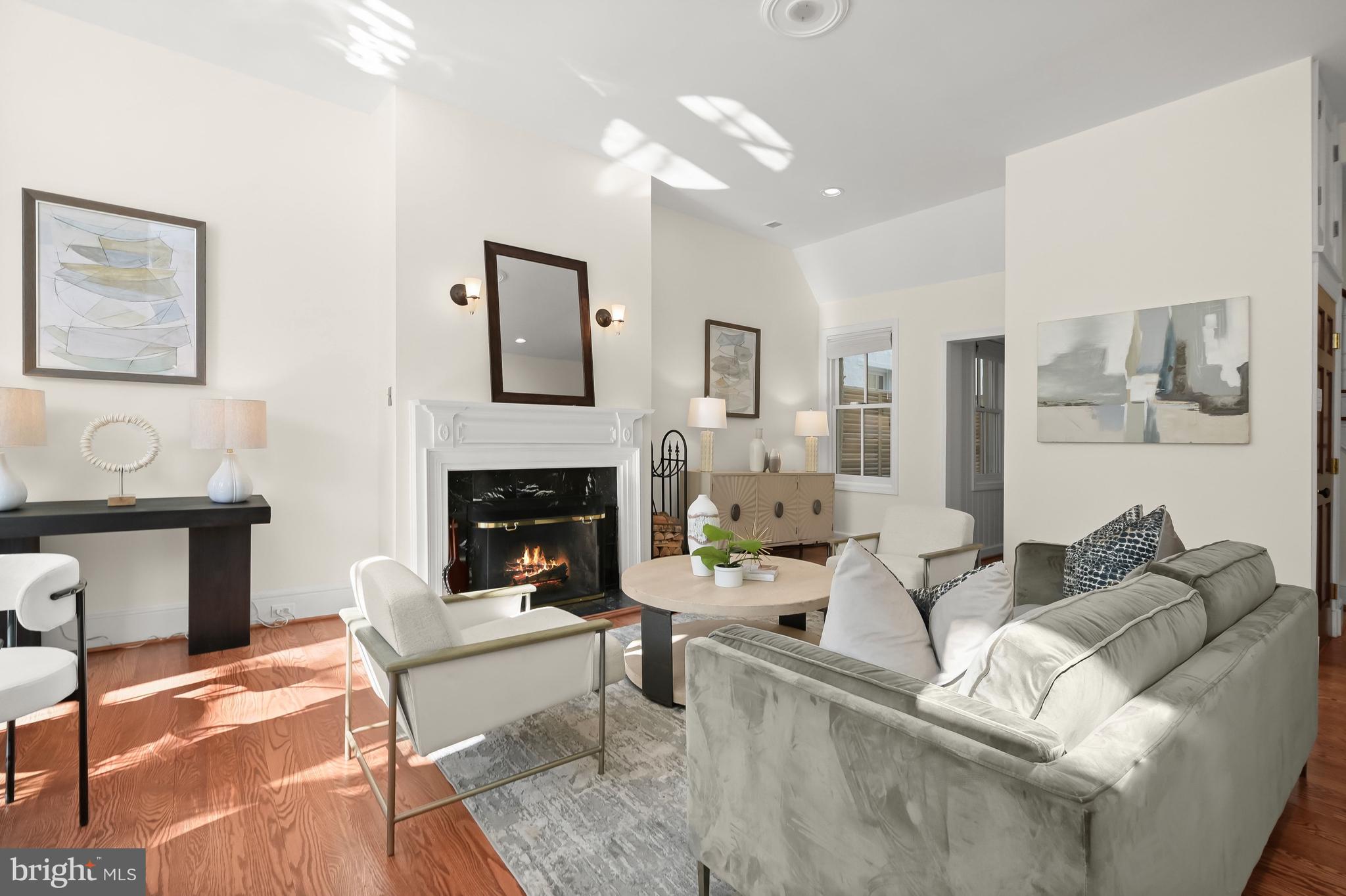 1745 S Street Northwest Washington, DC 20009 - Photo 5 of 19 a living room with furniture and a fireplace