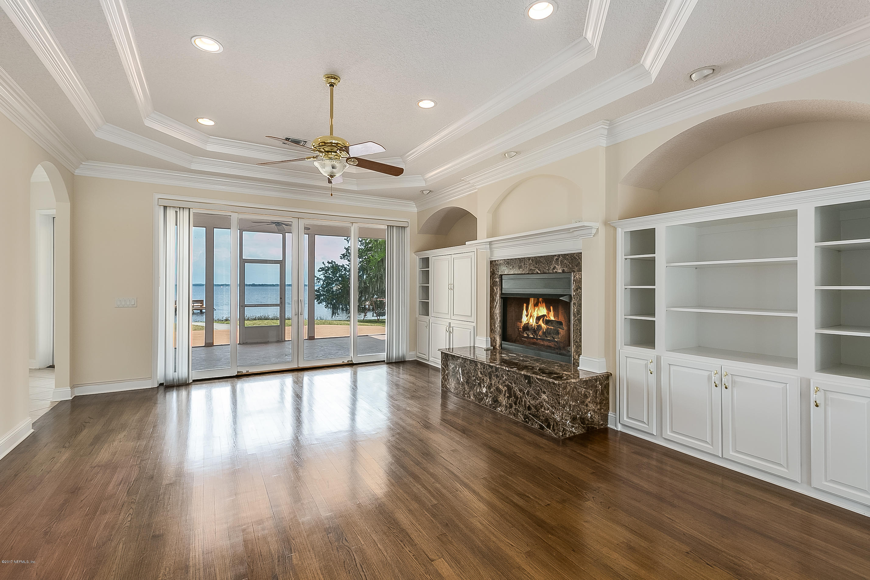 4205 Magnolia Road Orange Park, FL 32065 - Photo 4 of 36 a view of an empty room with wooden floor and a window