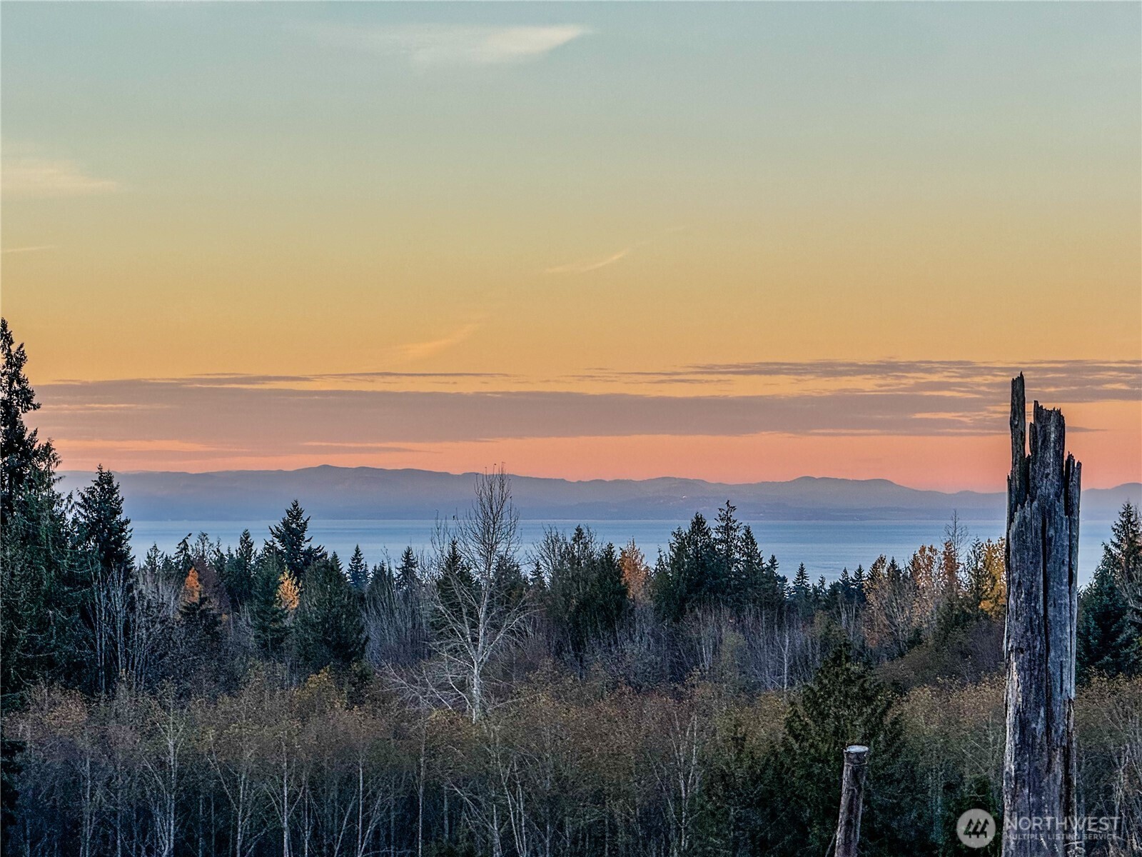 405 Elk Run Trail Port Angeles, WA 98362 - Photo 1 of 19 a view of a city and sunset
