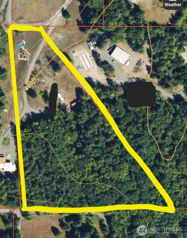 a view of swimming pool with a yard and sitting area