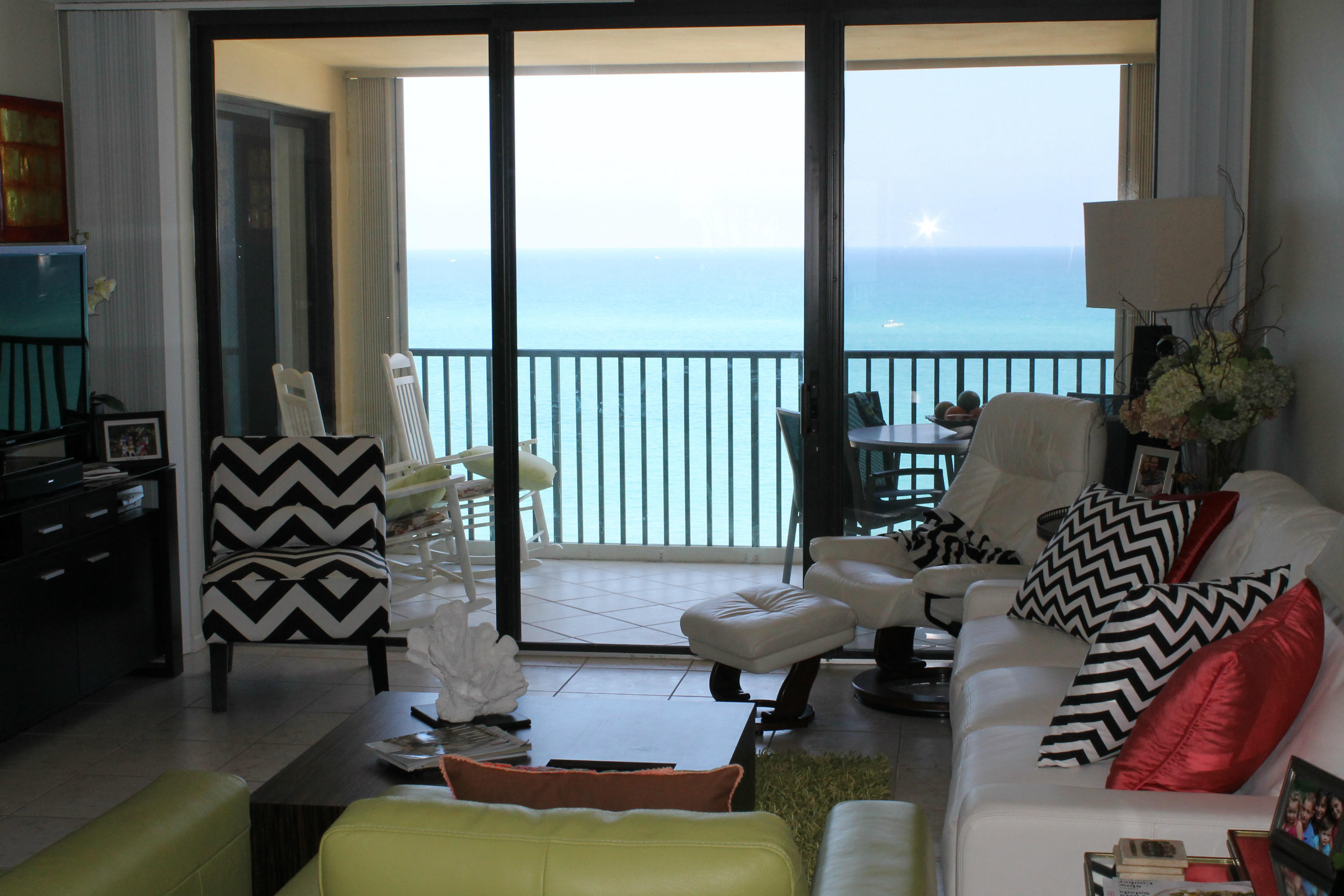 300 Ocean Trail Way, Unit 1010 Jupiter, FL 33477 - Photo 13 of 25 a living room with furniture and a floor to ceiling window