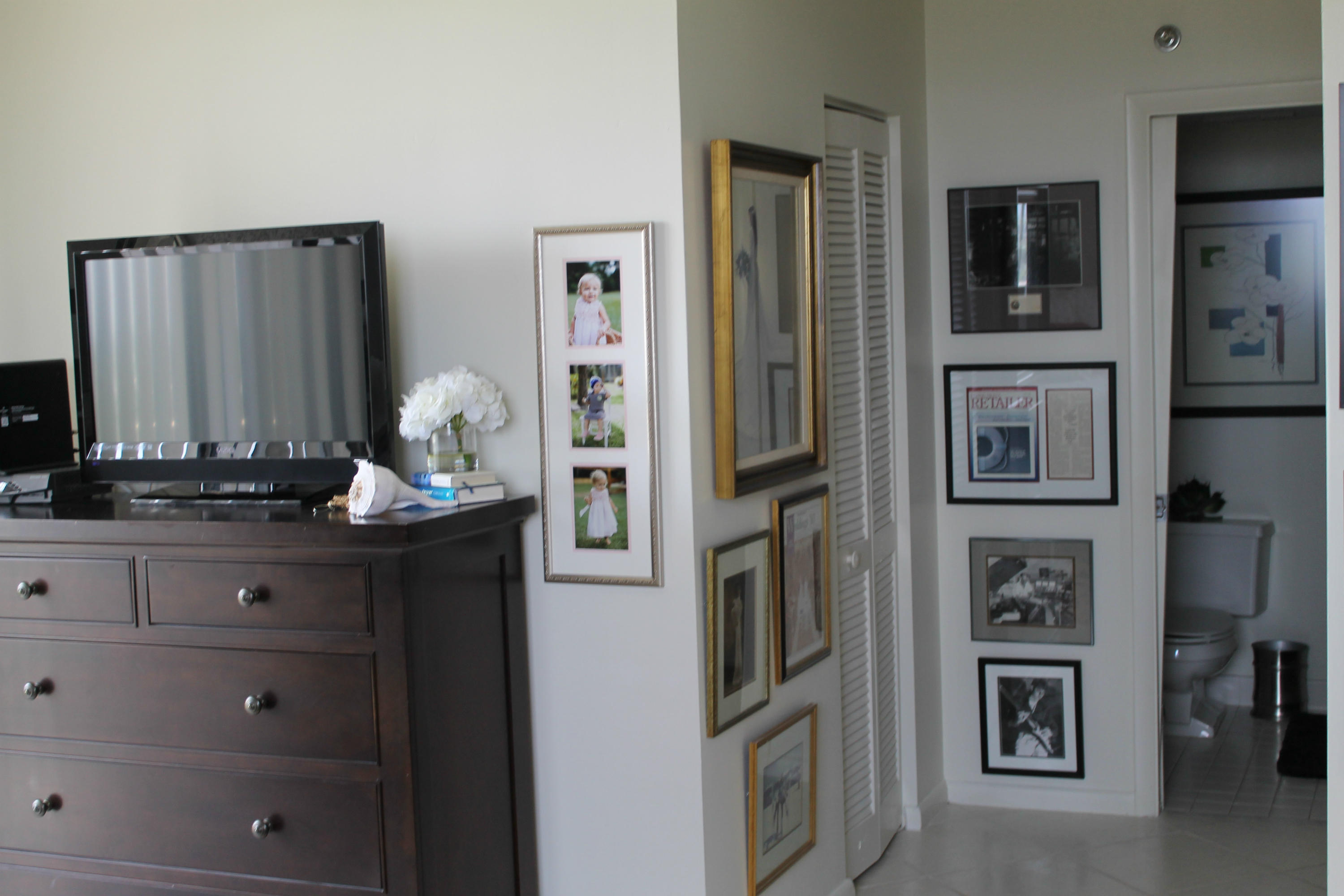 300 Ocean Trail Way, Unit 1010 Jupiter, FL 33477 - Photo 17 of 25 a living room with stainless steel appliances cabinets and flat screen tv